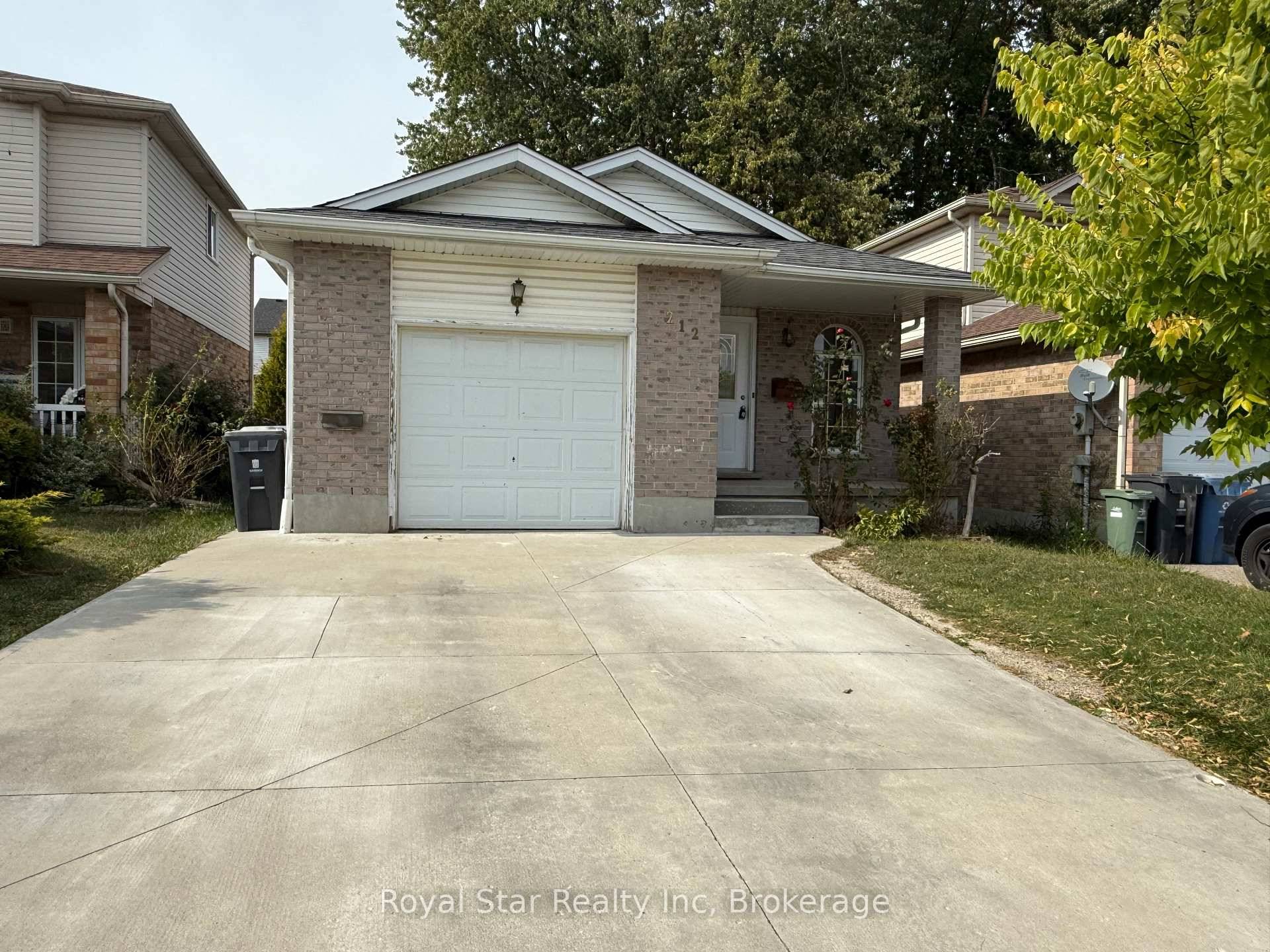 Welcome to 212 Country Club Dr, A charming 3 bedroom detached house features an open concept living and kitchen area with quartz counter top, perfect for modern living.