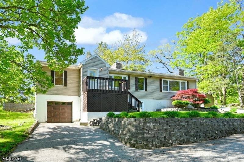 Raised Ranch Home, Updated in 2024, 2 Fireplaces, Huge Vaulted Living Room w Stone Fireplace, Skylights Beam Ceiling.