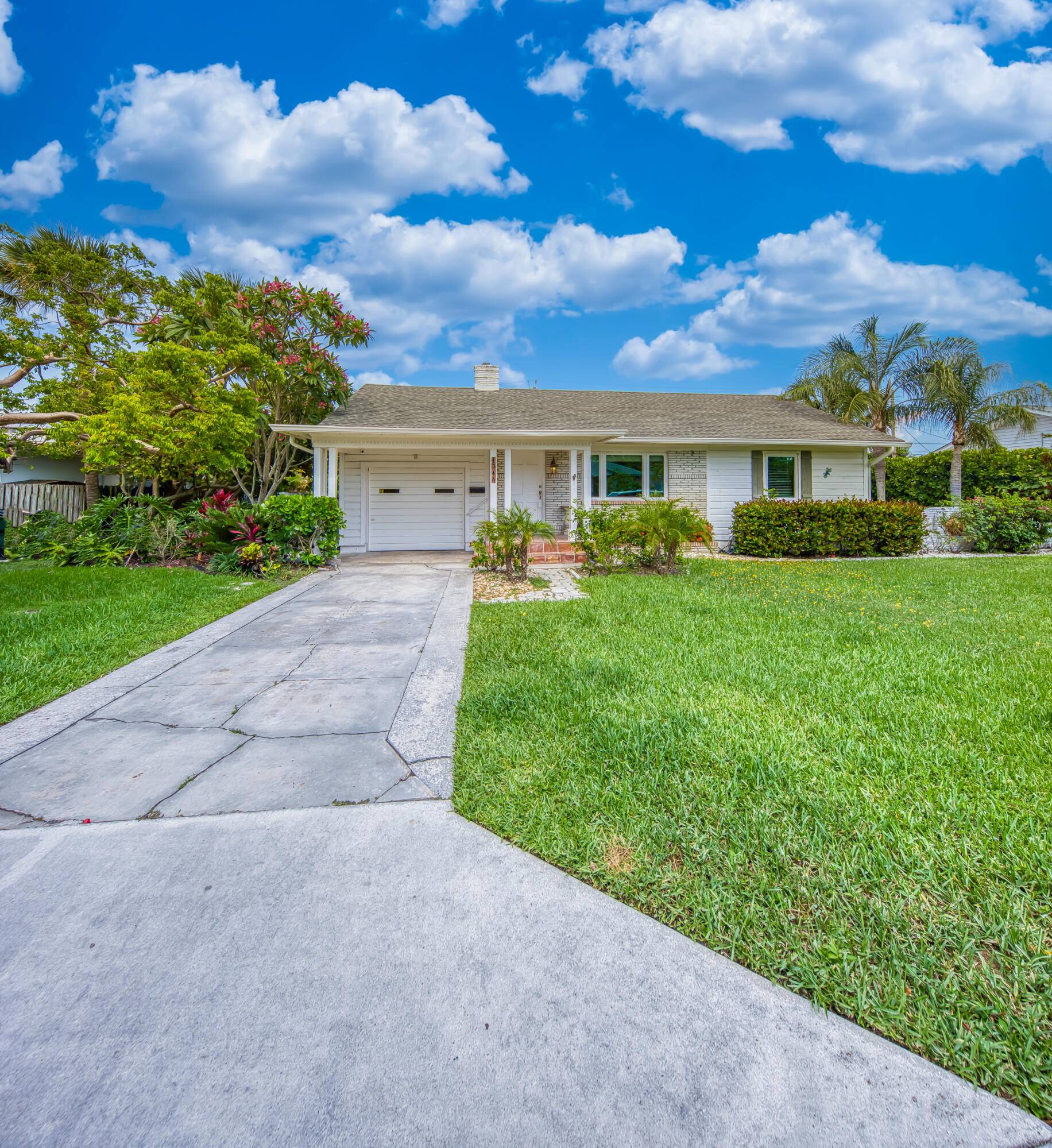 CHARMING COASTAL RETREAT IN EDEN PLACE NESTLED IN THE SOUGHT AFTER NORTH END OF LAKE WORTH BEACH, JUST STEPS FROM THE INTRACOASTAL WATERWAY.