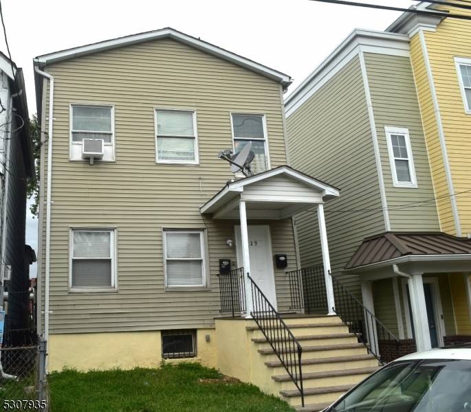 INVESTOR OPPORTUNITY for this 2 Family home.