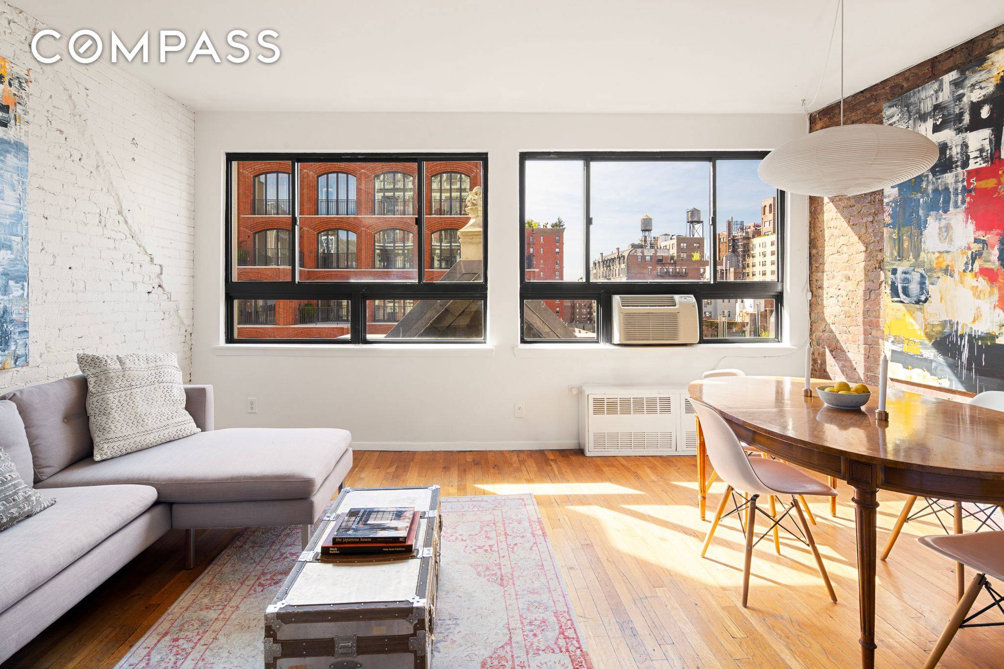This top floor 2 Bedroom loft like home in a pre war doorman building features a wall of windows and stunning western views over Greenwich Village.