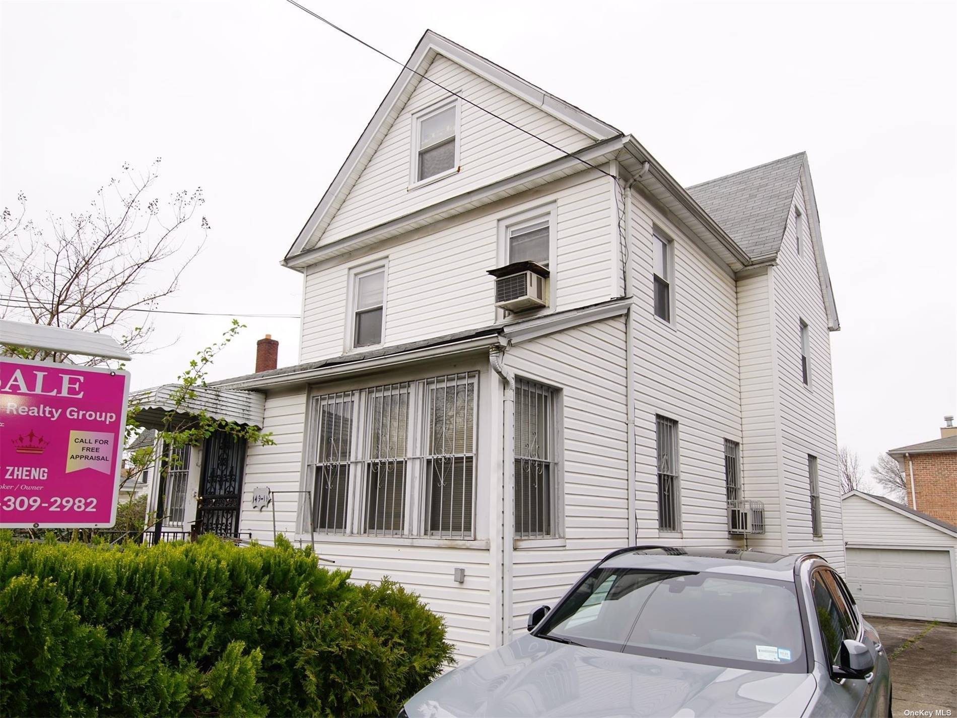 DETACHED two family colonial.