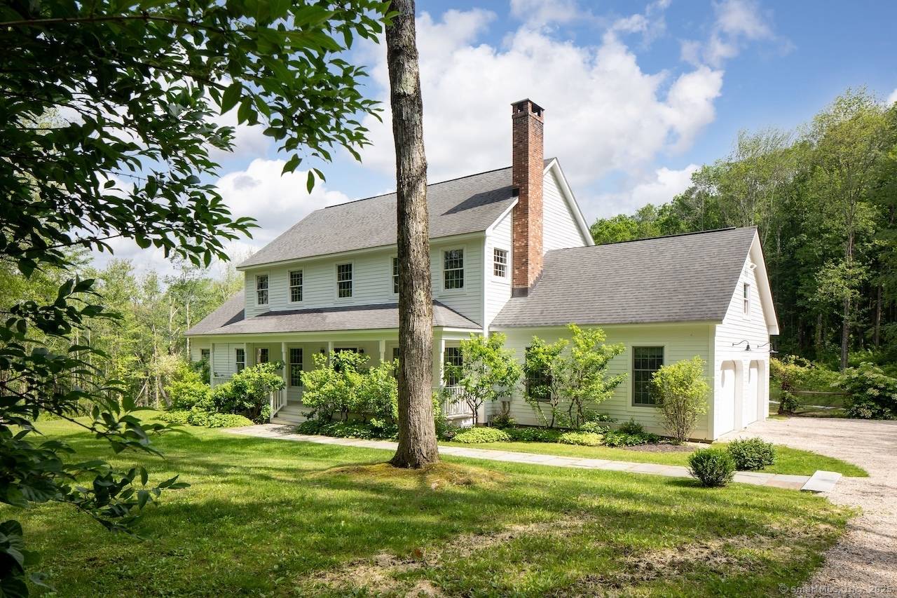 Set on 7 private acres directly across from protected conservation land, this beautifully renovated home offers peaceful wooded views, exceptional privacy, and modern comfort in a prime Sharon location.