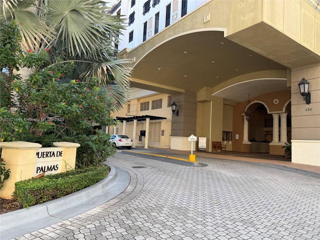 Immaculate corner unit at Puerta de Palmas featuring unobstructed skyline views from private balcony.