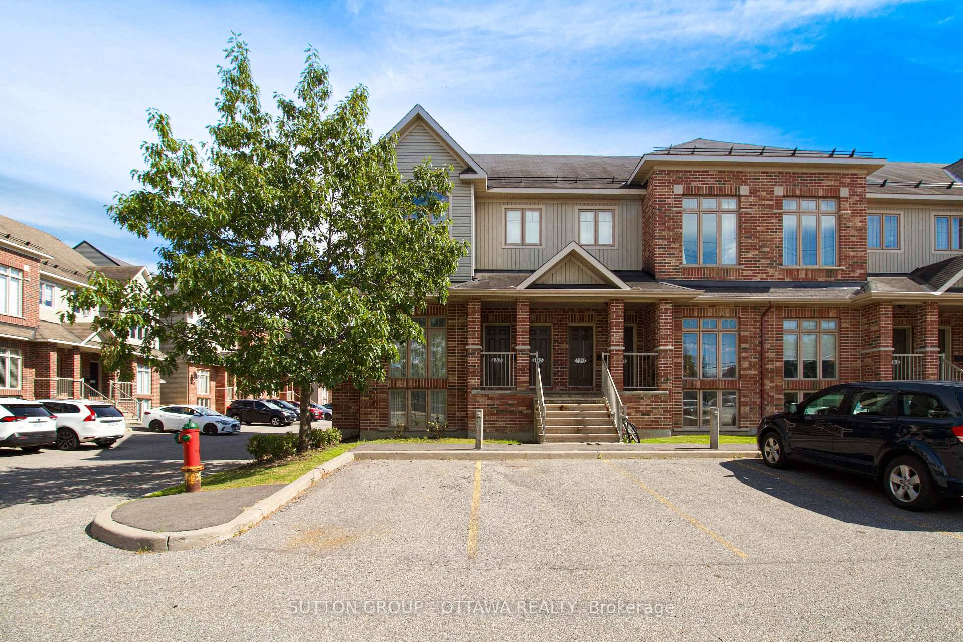 Tucked into a well connected community, this bright end unit condo spans two levels and offers a rare mix of character, light, and functionality.