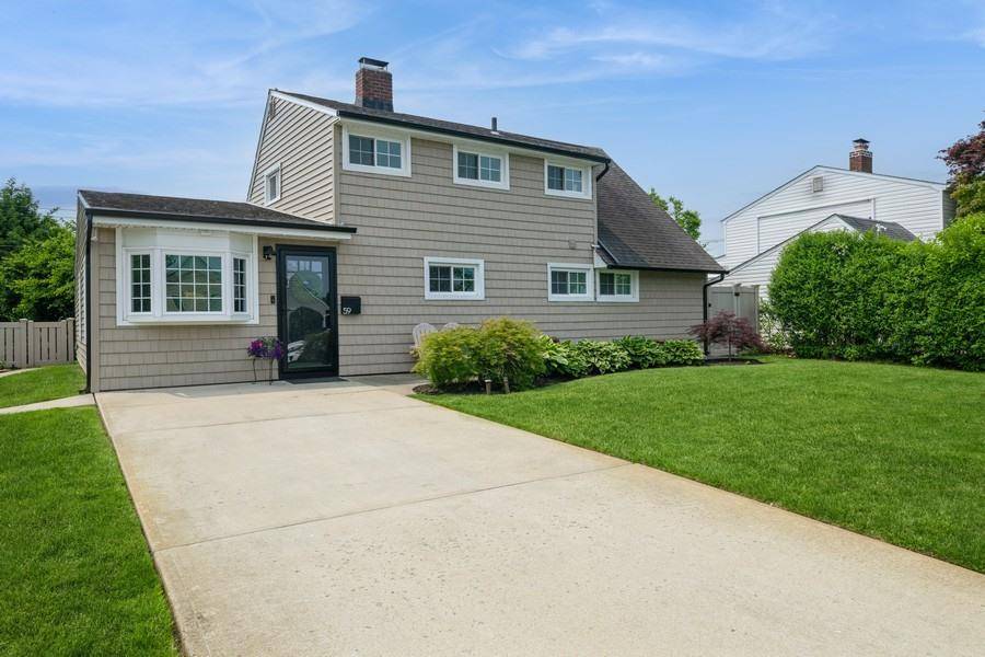 Welcome To This Expanded Cape Style Home Featuring 5 Bedrooms And 2 Full Bathrooms.