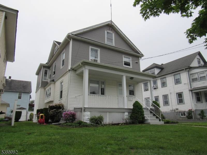 Charming and well maintained two family home featuring a beautiful front porch.