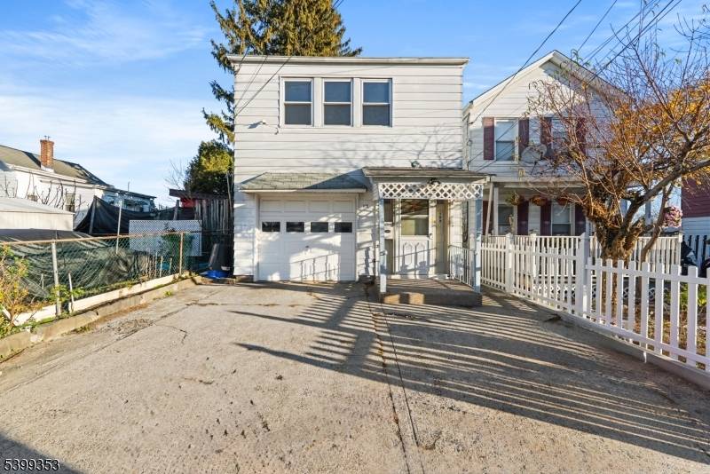 Beautiful bi level home in Paterson, ideally located near the Woodland Park border.