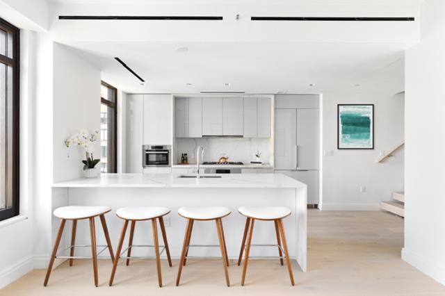IMMEDIATE OCCUPANCY ! This four bedroom duplex home is graciously appointed with 9' 5'' ceilings, generously proportioned living spaces, and three and a half bathrooms.