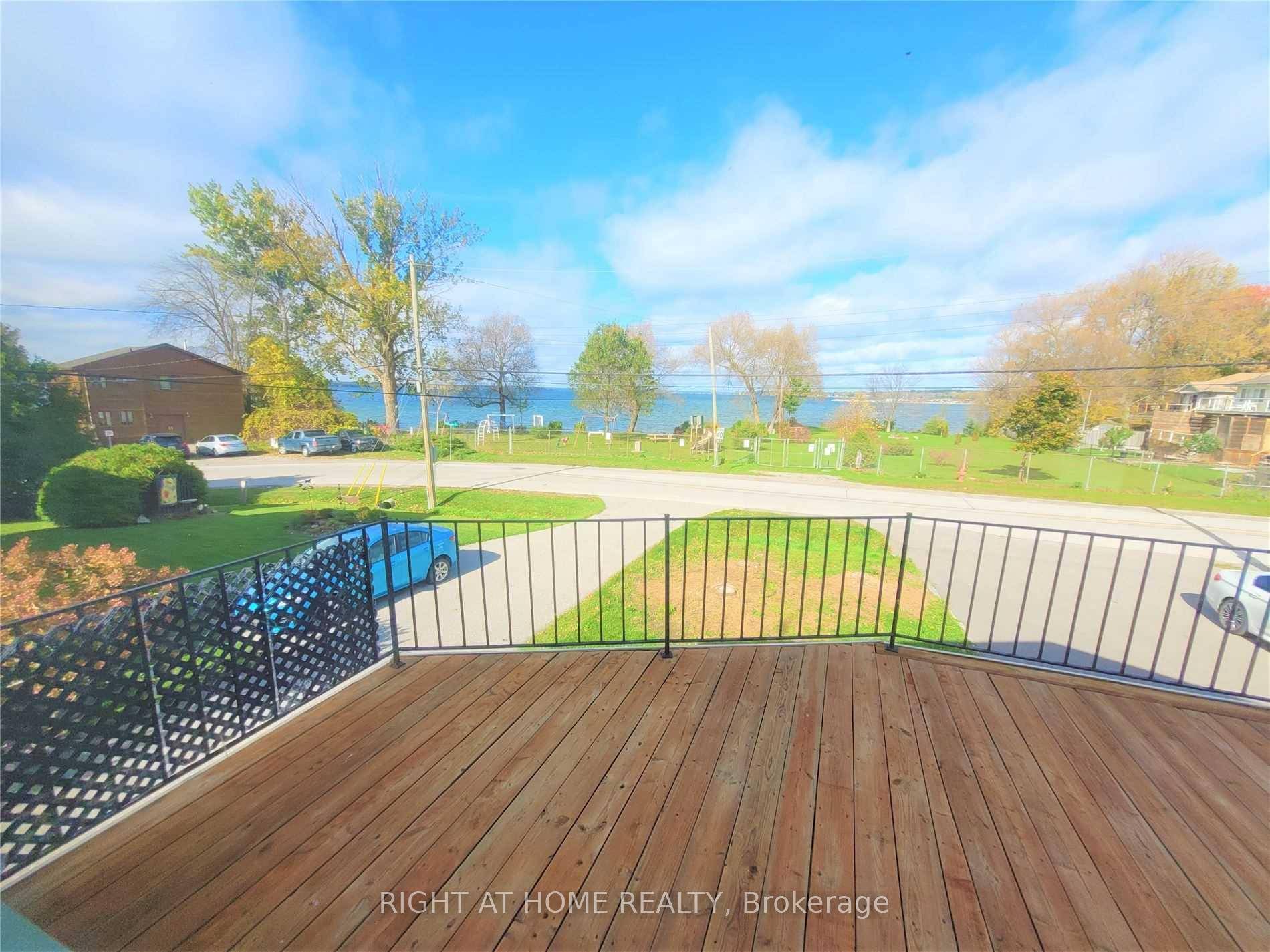 Unobstructed Lake View ! 2 Bedroom Upper Unit, Spacious Living Room, Large Private Deck Over Looking The Lake.