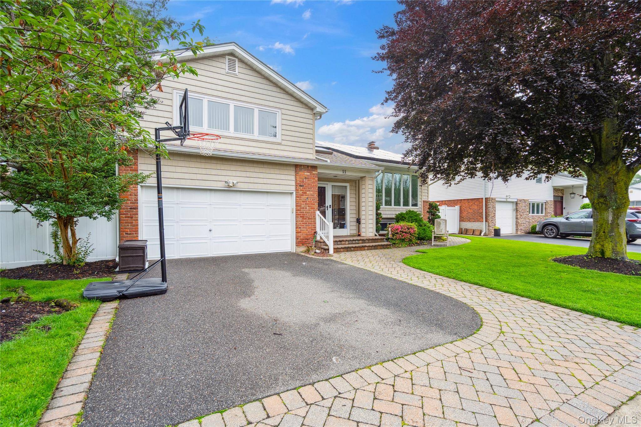 Bright and spacious expanded Suburban Greens Hi Ranch in the Manetto Hills Section of Plainview.