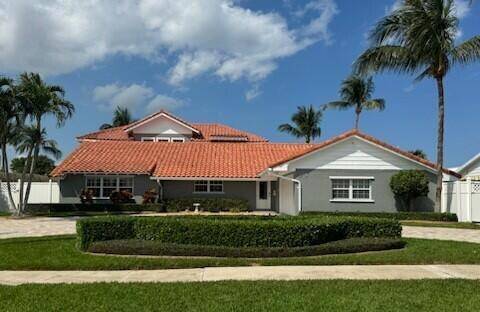 Grab this property in the coveted Village of North Palm Beach where there is no HOA.