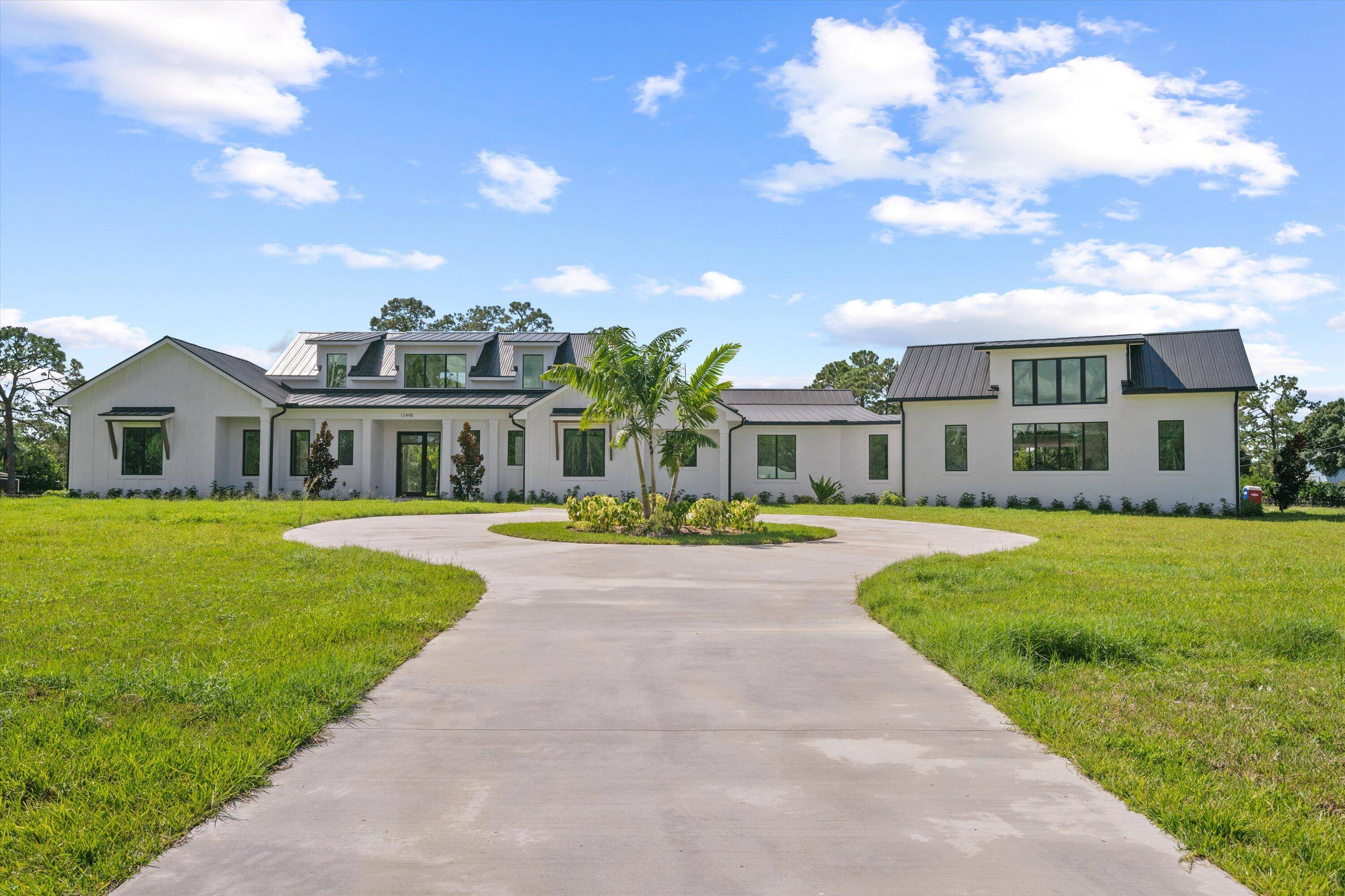 This stunning custom coastal farmhouse is a spacious single story home offering 4, 766 A C sf of luxurious living space and 7, 403 total sf.