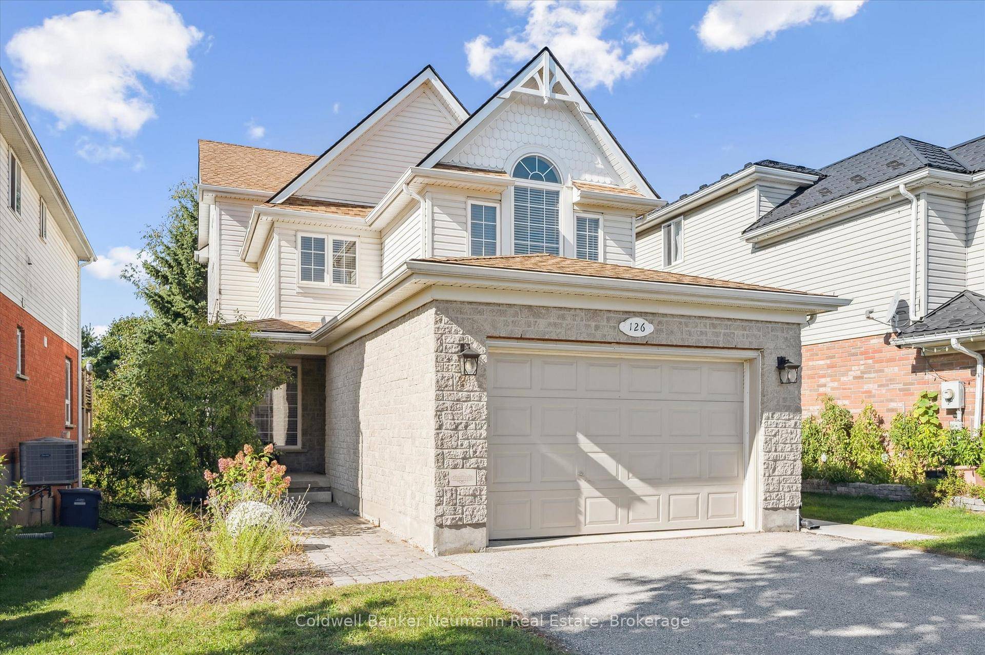 Wonderfully updated home with legal basement apartment backing on to green space !
