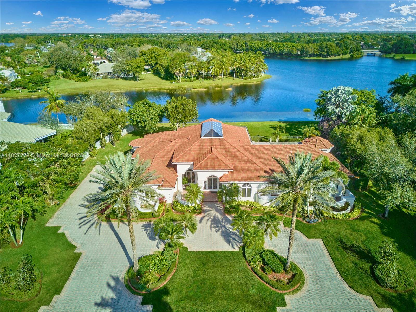 This one of a kind glass estate in Windmill Ranches offers panoramic water vistas from nearly every room.