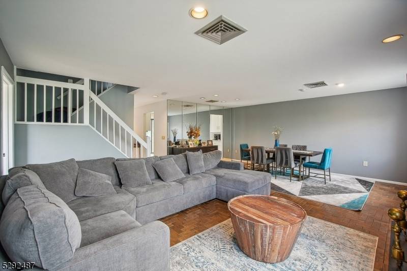 Step into this spacious and light filled three level townhome with a walk out basement, nestled in the desirable gated Eagle Ridge community.