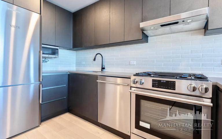 he unit boasts modern stainless steel appliances, abundant natural light, and bright, airy spaces.