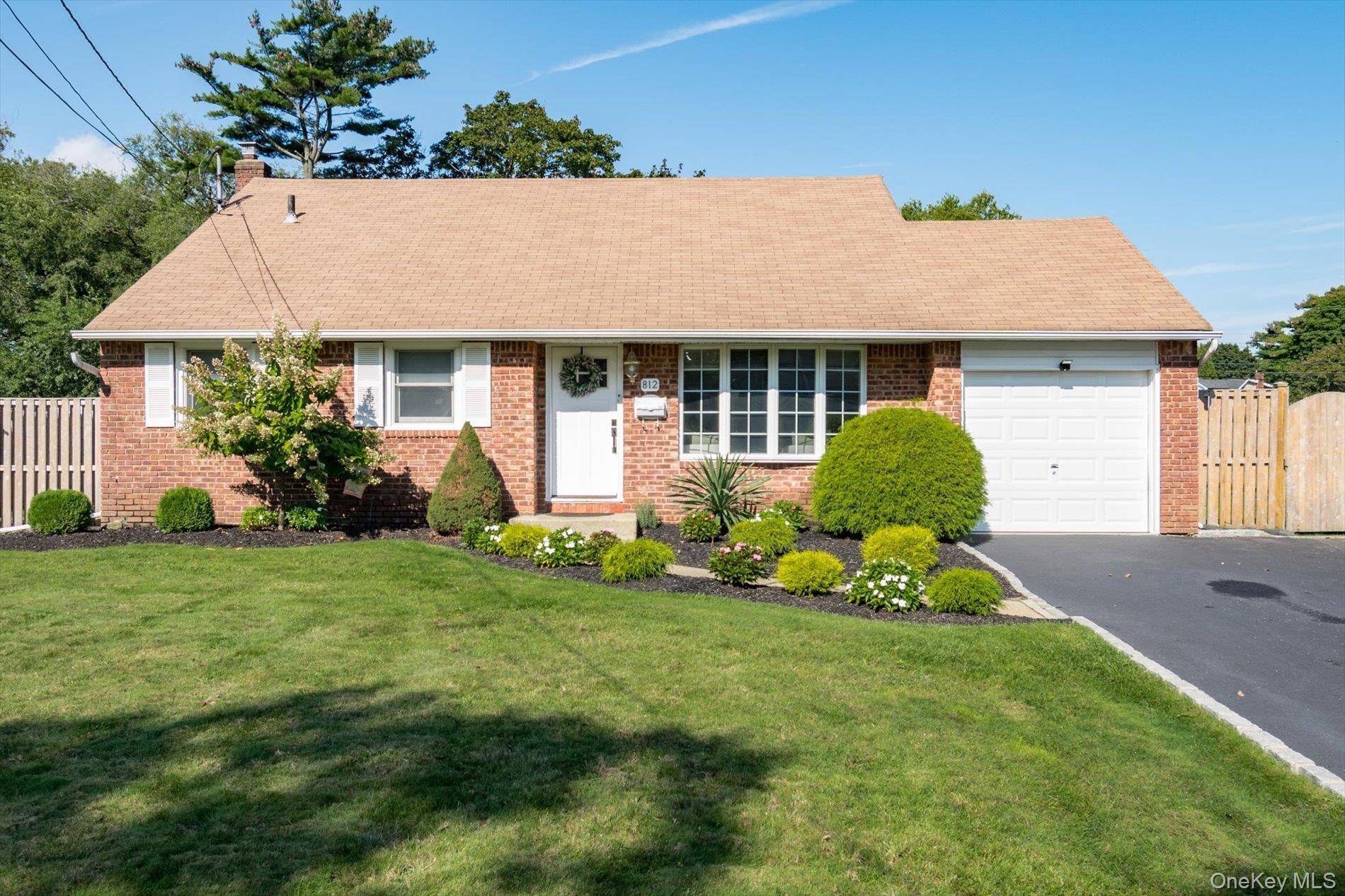 Welcome to this charming split level home on a quiet and serene block in West Islip.
