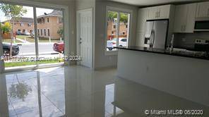 Practically new 4 BD 3 1 2 BA townhouse 1 BD 1BA downstairs built to endure any hurricane safely with ease comfort concrete walls roof, high impact windows doors.