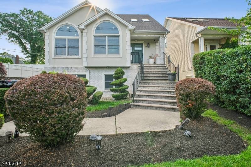 Expansive custom home nestled on lushly landscaped secluded grounds.