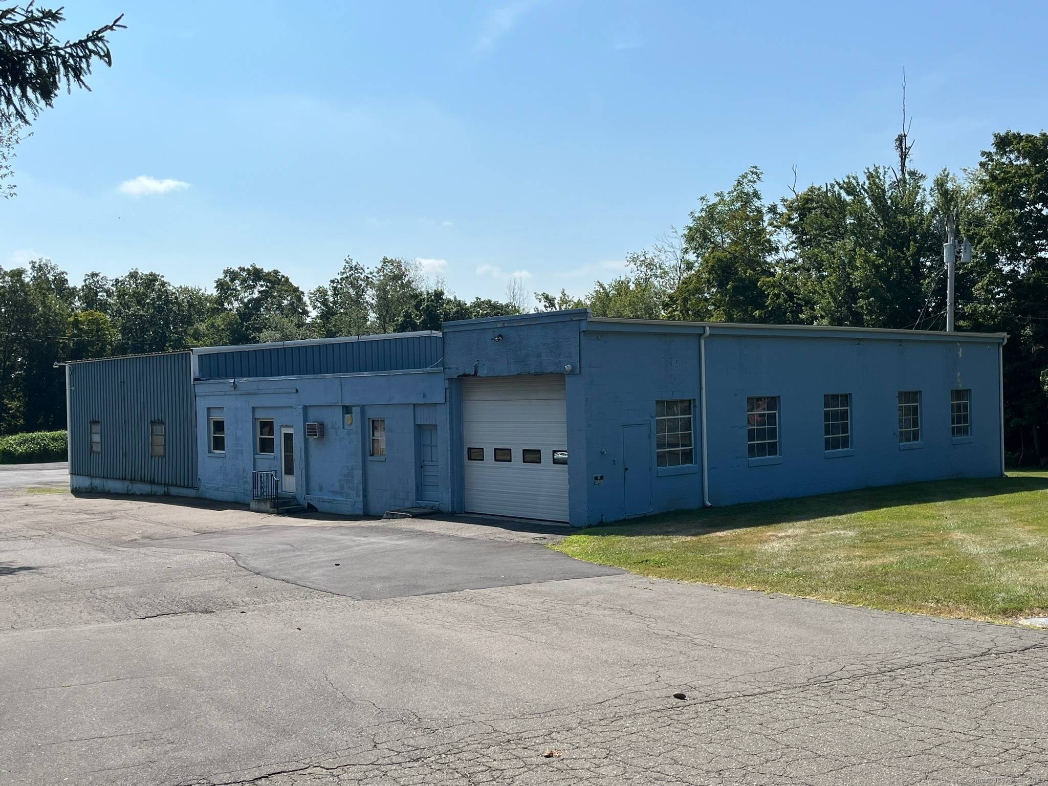 7, 350 sq. ft. industrial metal building, ideal for trucking operations with ample yard space and on site fuel tank.