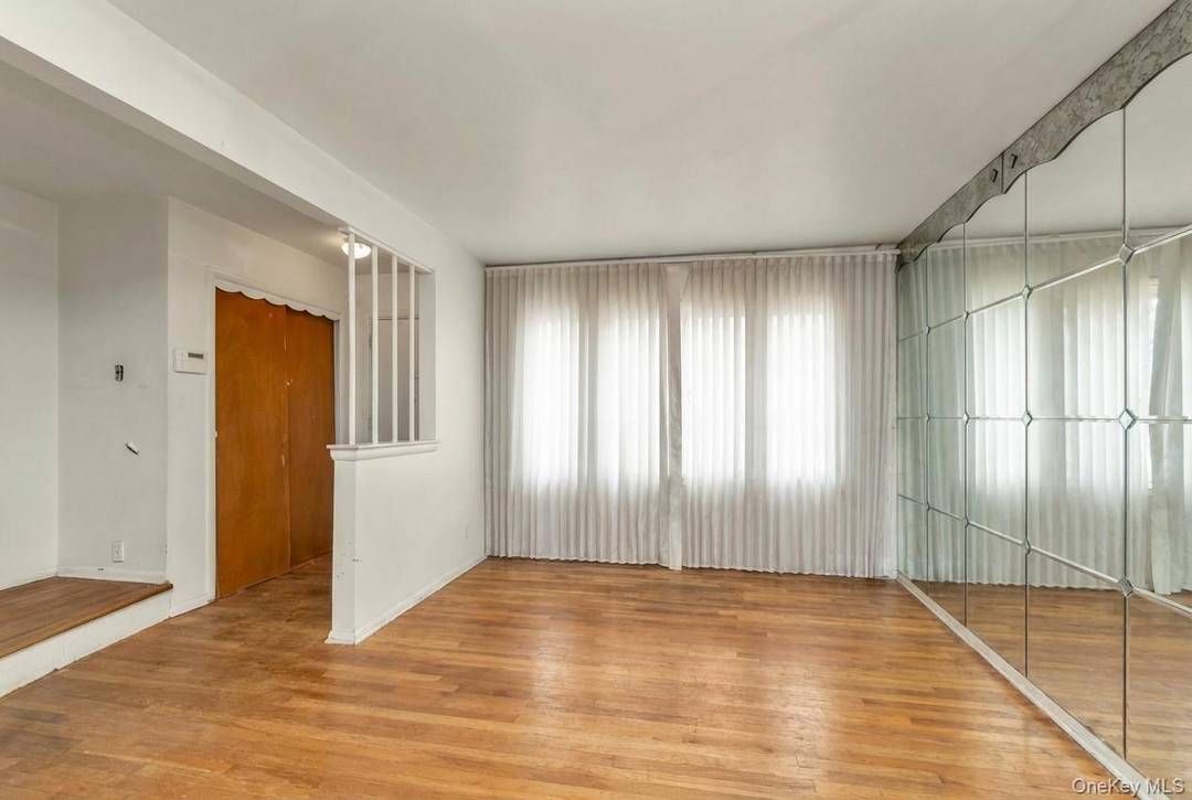 Sunny Brick and Frame Semi Detached Colonial in the Heart of Cambria Heights.