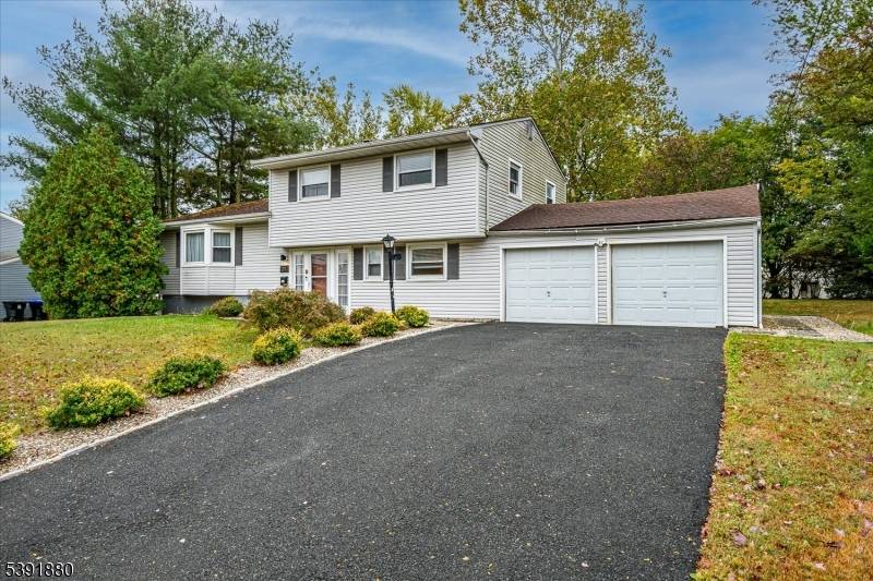 This split level is conveniently located in Lawrence Brook across from the middle school.