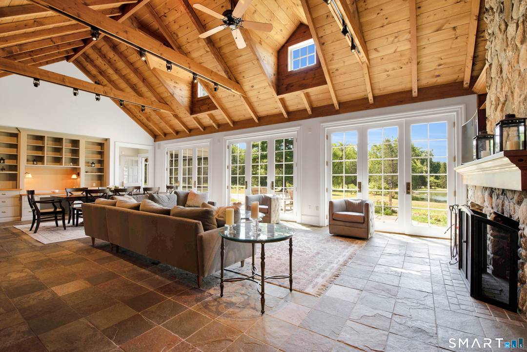 Welcome to this extraordinary stone and shingle country estate, nestled on 70 acres of private retreat.