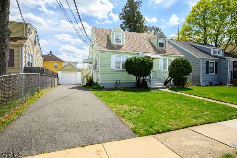 Charming Cape Cod Comfort in a Prime Plainfield Location nestled just off Terrill Road near the Scotch Plains border, this classic Cape Cod style home combines character, convenience, and opportunity.