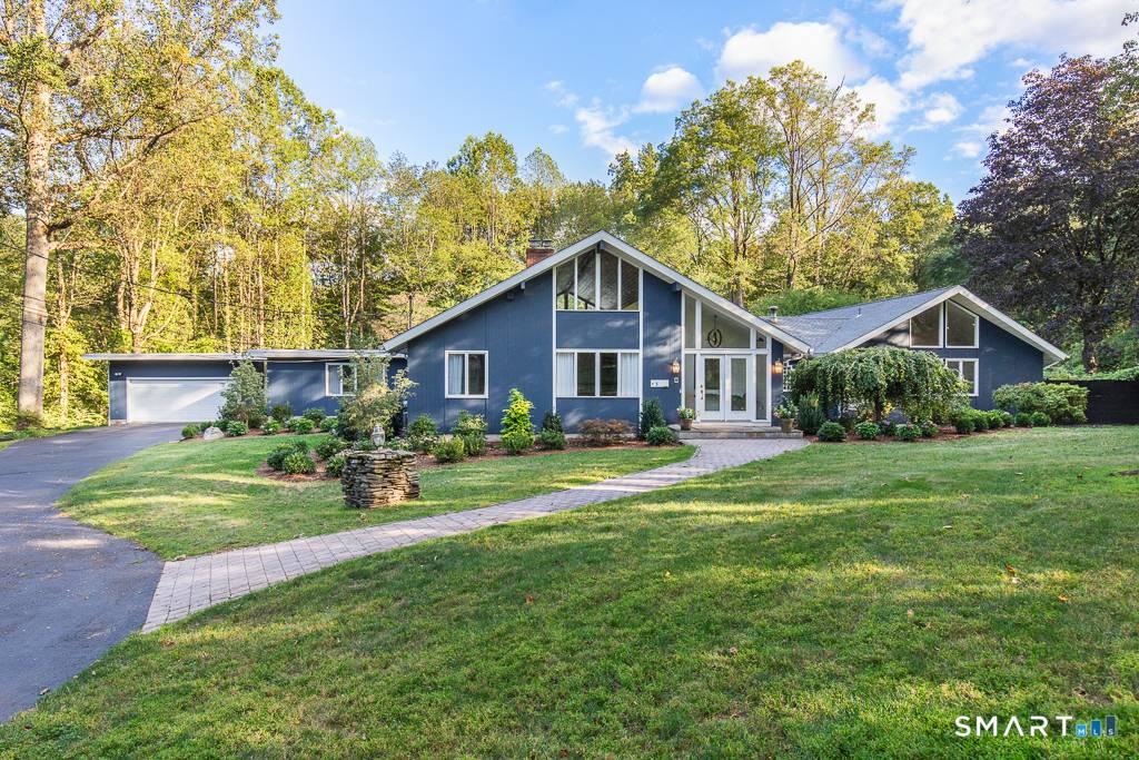 Stunning custom contemporary ranch tucked at the end of a quiet cul de sac !