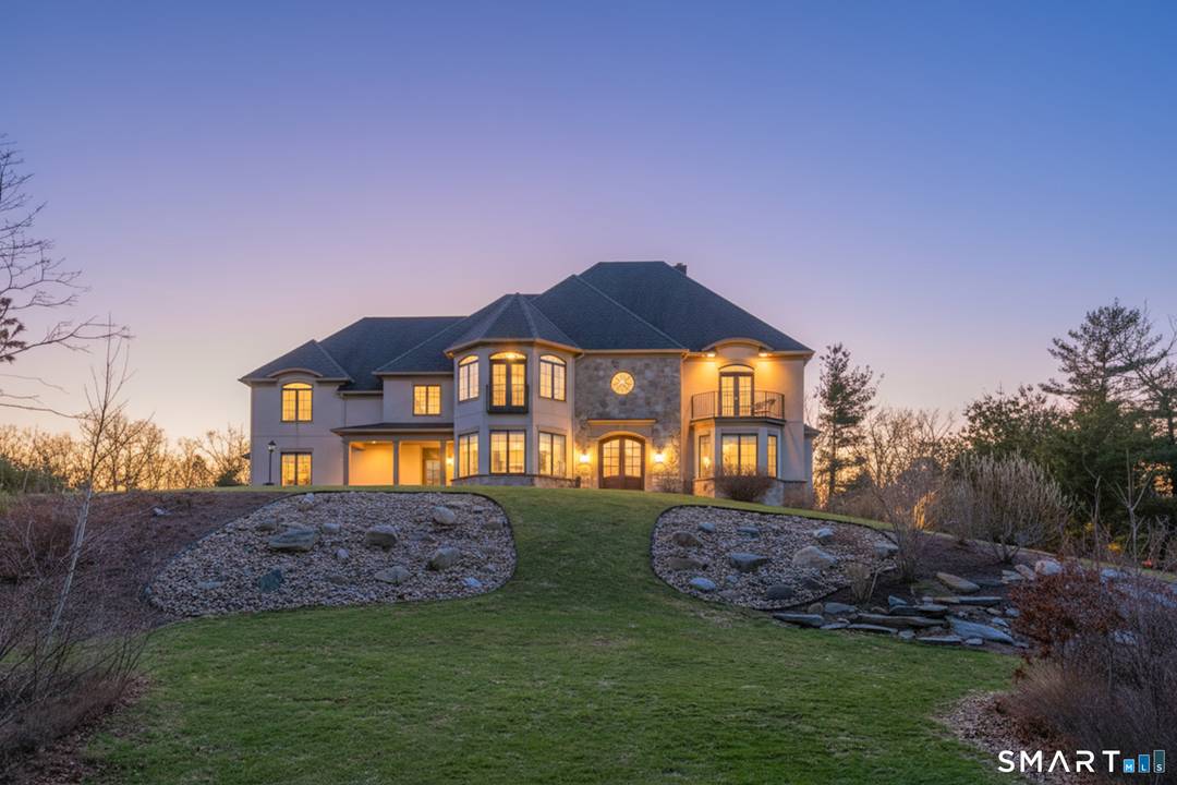 Custom Catarino built French Country residence, located on a cul de sac in an enclave of fine homes, seamlessly blends rustic charm with modern elegance.