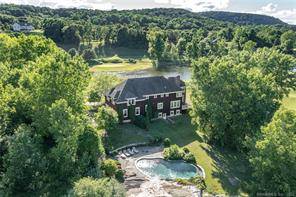 Incredible country home with heated gunite swimming pool skillfully blended into the natural stone landscape.