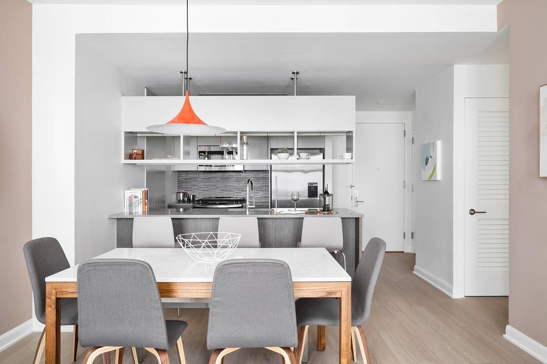 Southern facing one bedroom featuring a gourmet kitchen with stainless steel appliances, quartz countertops and eating bar, space for a dedicate dining or home office area, an in unit washer ...