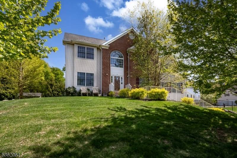 Step into this beautifully maintained Center Hall Colonial, featuring a dramatic two story foyer that sets the tone for this spacious and light filled home.