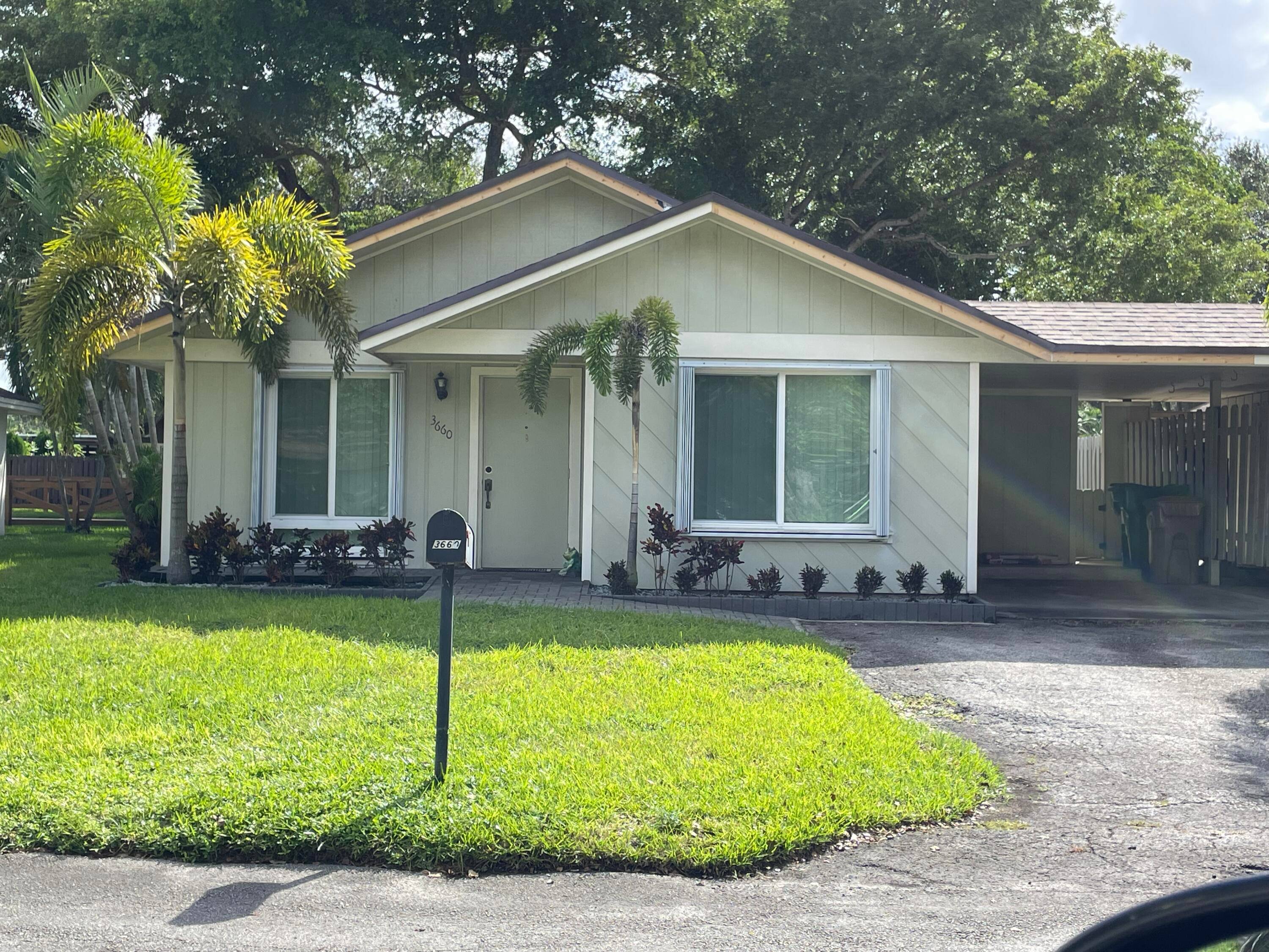 Very low HOA. Lovely neutral updated 3 bedroom 2 bath villa with 1 car covered carport plus 2 additional parking spaces on driveway.
