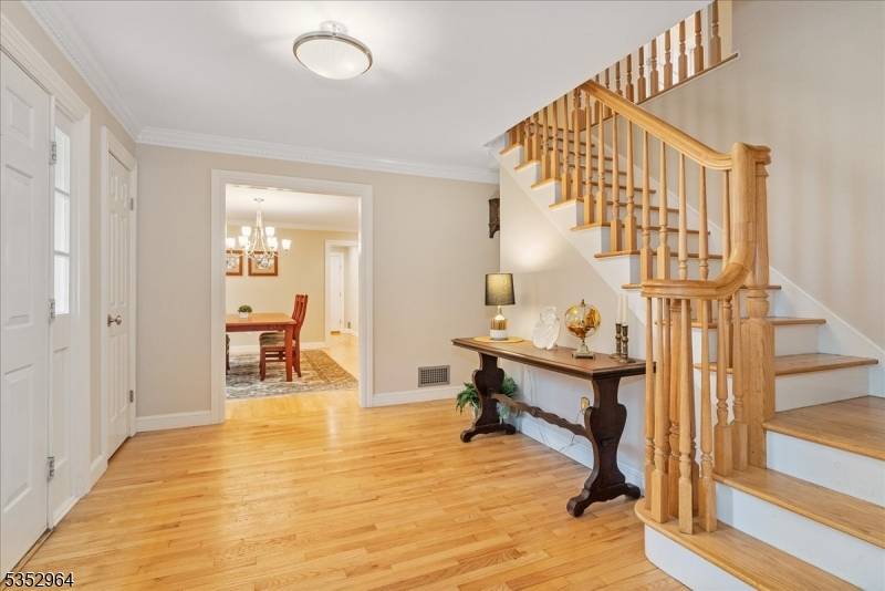 Tucked away on two serene acres at the end of a quiet cul de sac, this charming 4 bedroom, 2.