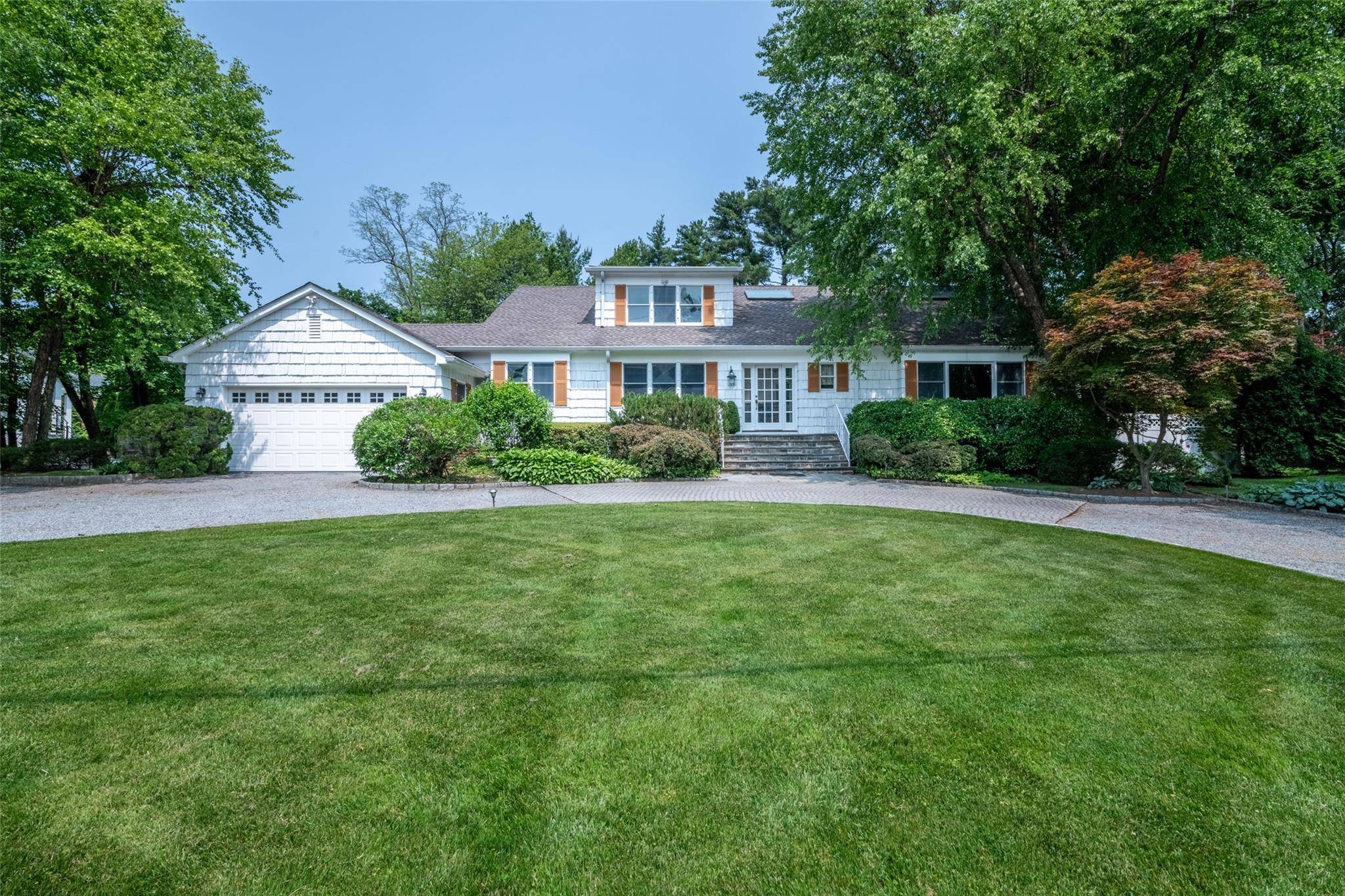Welcome to this bright and spacious home featuring a marble entry hall, formal dining room and living room.