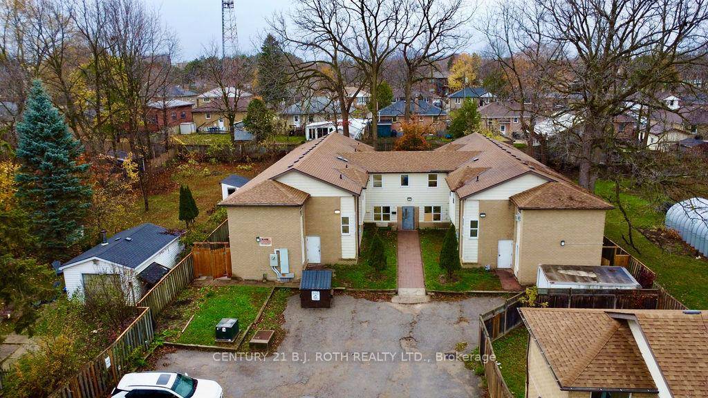 43 bedroom rooming house with 2 huge kitchens on a large property with ample parking.