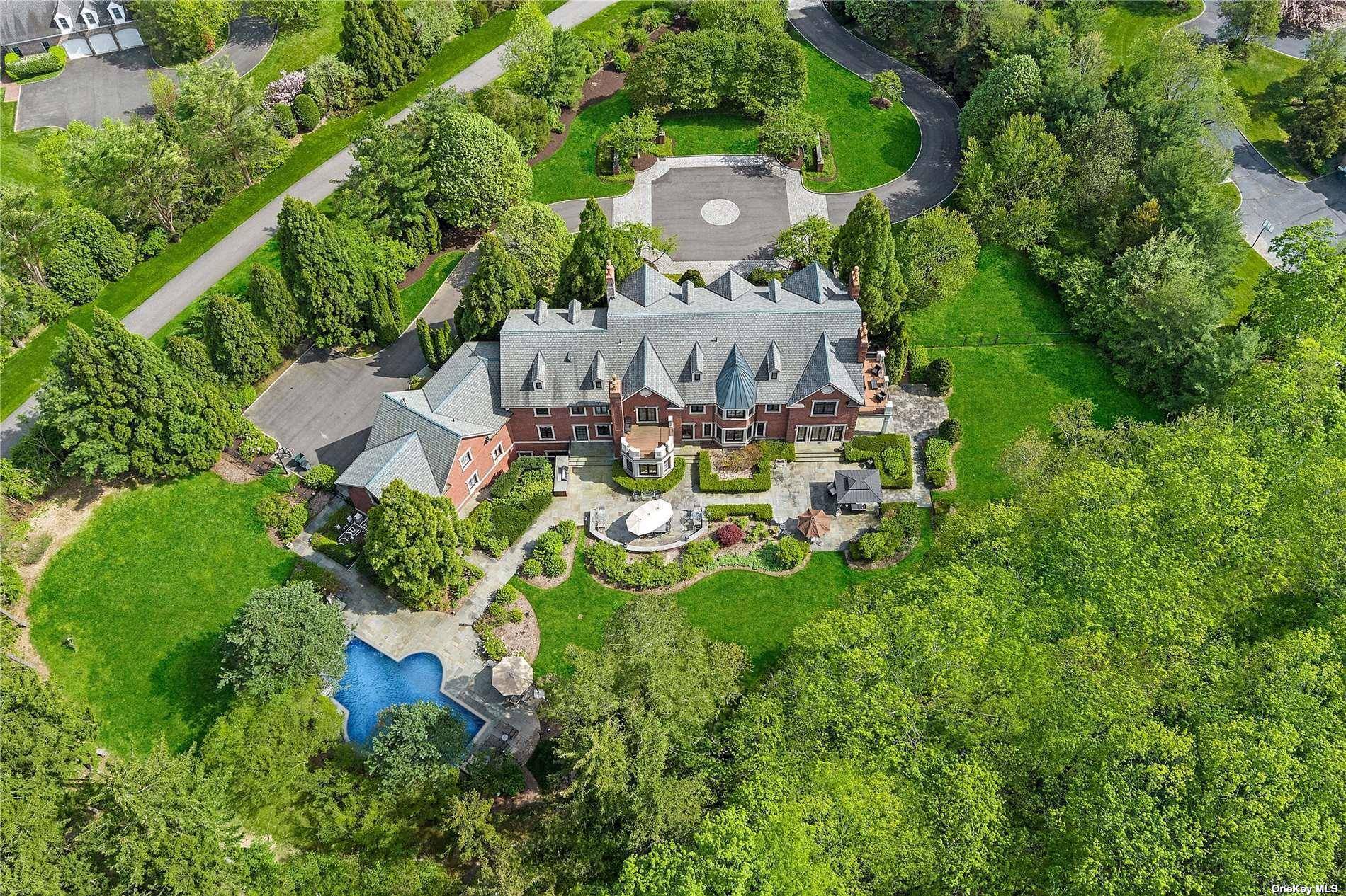 Welcome to the epitome of luxury living at 10 Orchard Lane, nestled in the prestigious enclave of Old Westbury, NY.