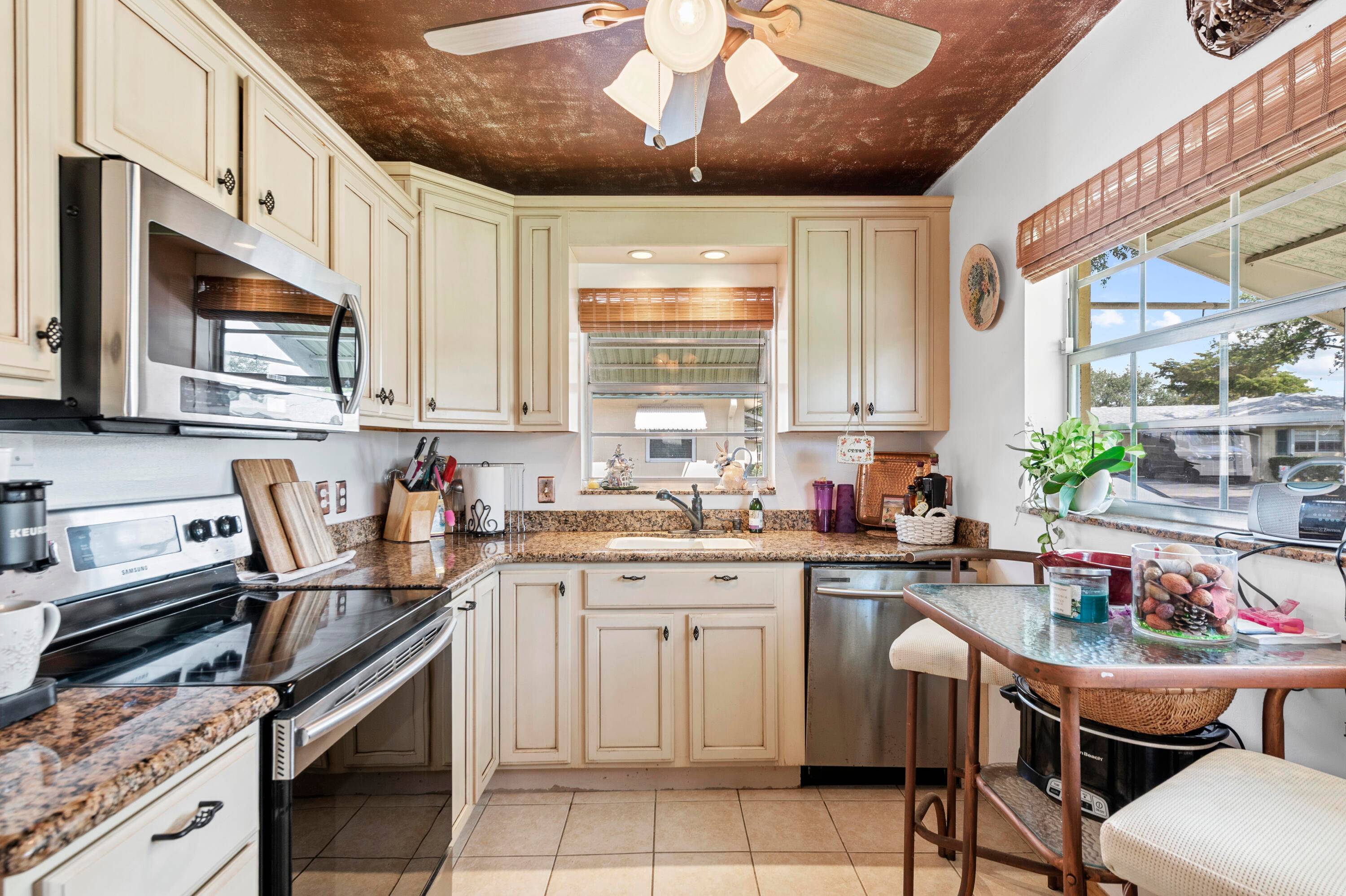 Welcome to this beautifully remodeled and well maintained villa located in the peaceful and quiet Country Manors community.