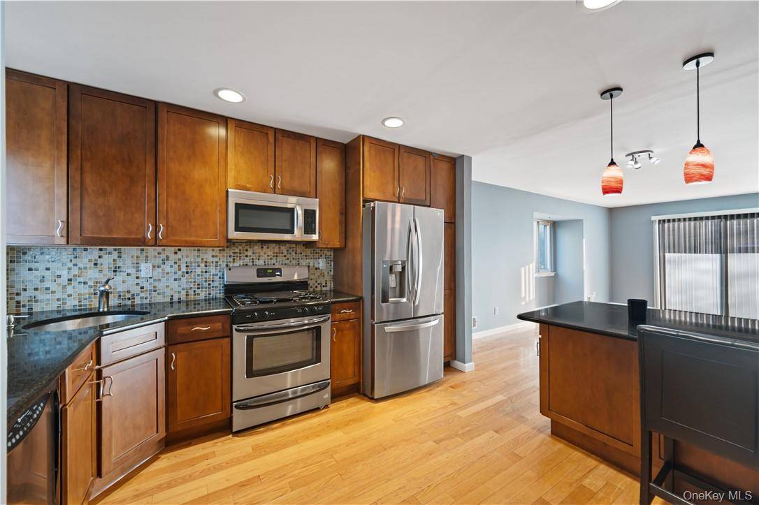 Be sure to come tour this beautifully updated end unit townhouse in Brookside Village is in the heart of Mt.