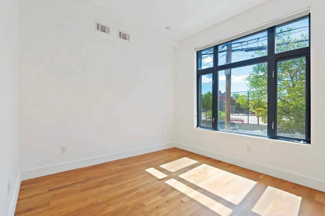 Experience the epitome of urban living in this recently renovated three bed, two bath apartment, boasting a massive 500 square foot private backyard.