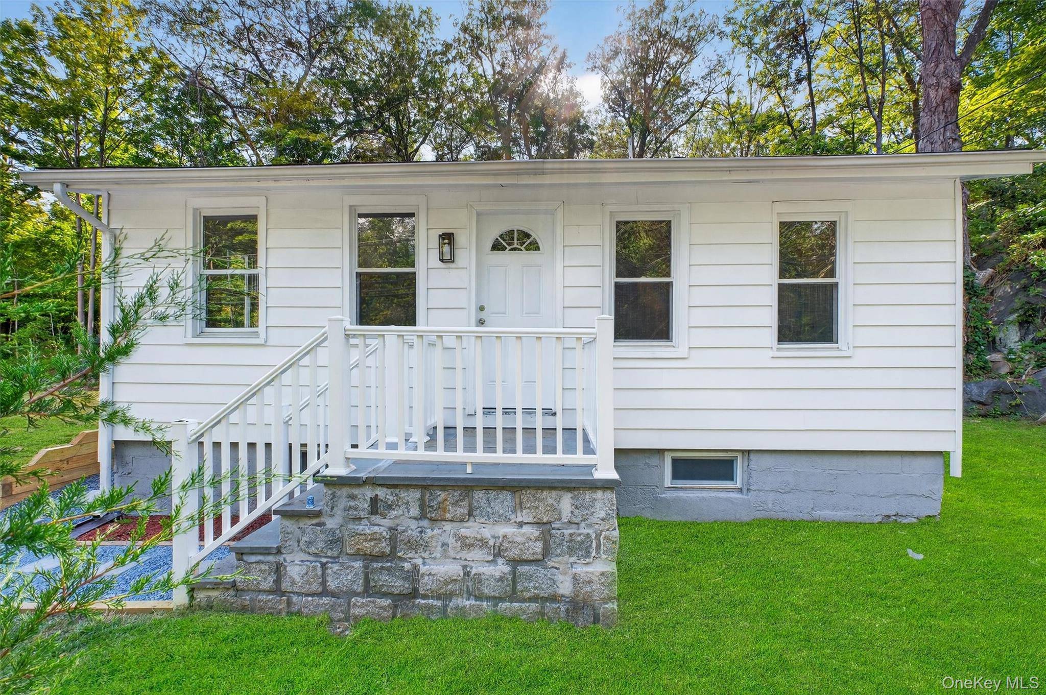 Completely updated two bedroom cottage with eat in kitchen, large yard, full basement, and new septic system.