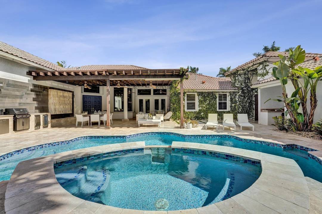 Very rare extended Courtyard Model with an expanded freestanding guest suite and built in office.