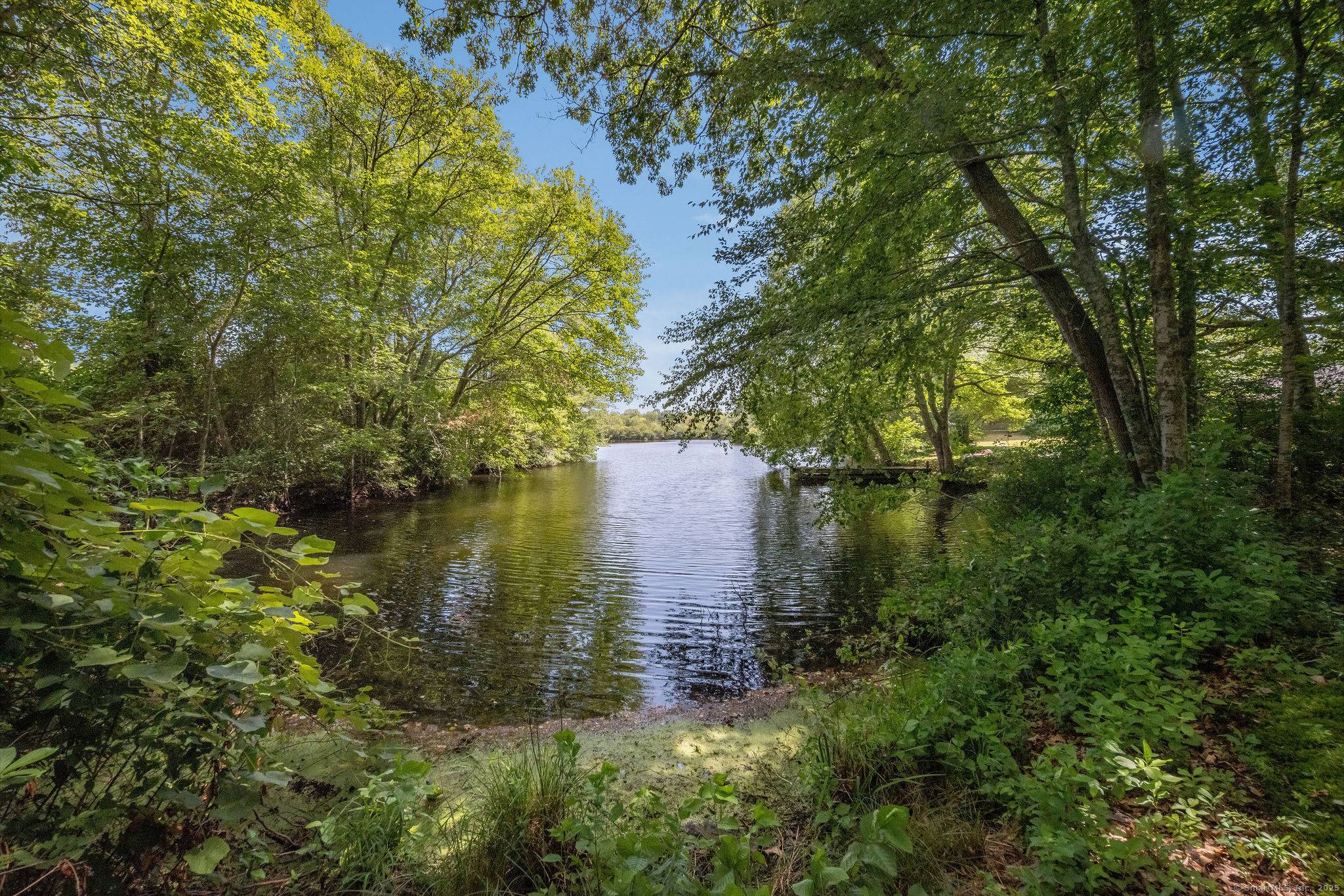 Built in 1998, this 2 Bedroom, 2 full bath Colonial with 2 car garage sits on over an acre with pond views.