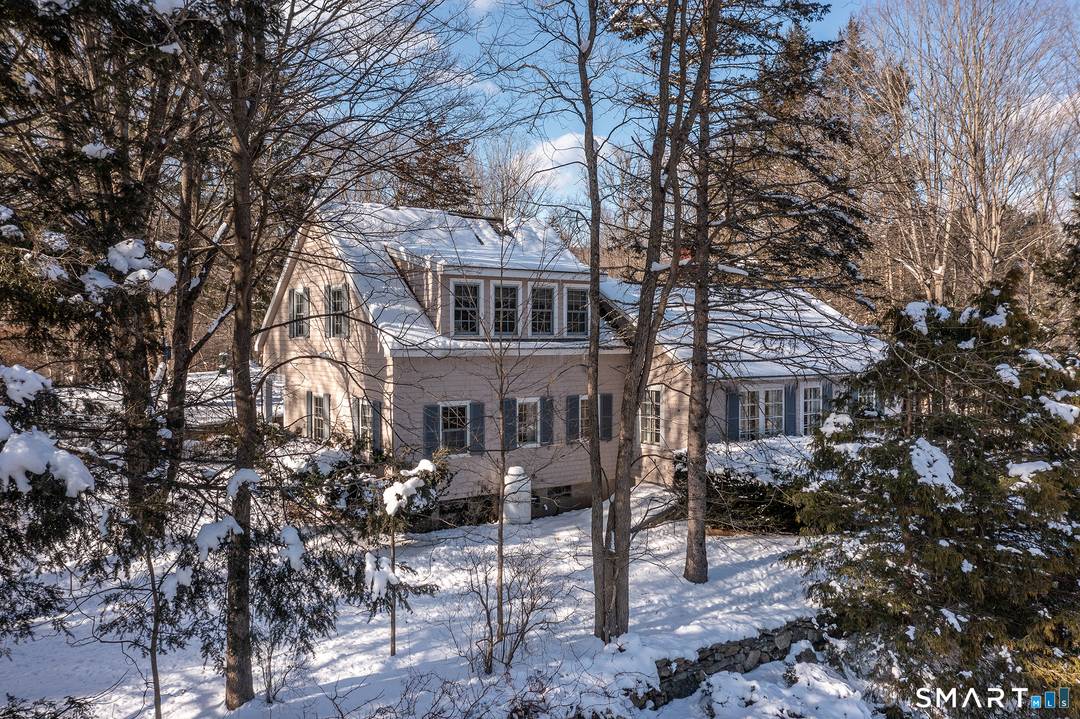 Overlooking neighboring pastureland and set on 5 private acres with a small pond, this three bedroom cottage is rich in charm and character.