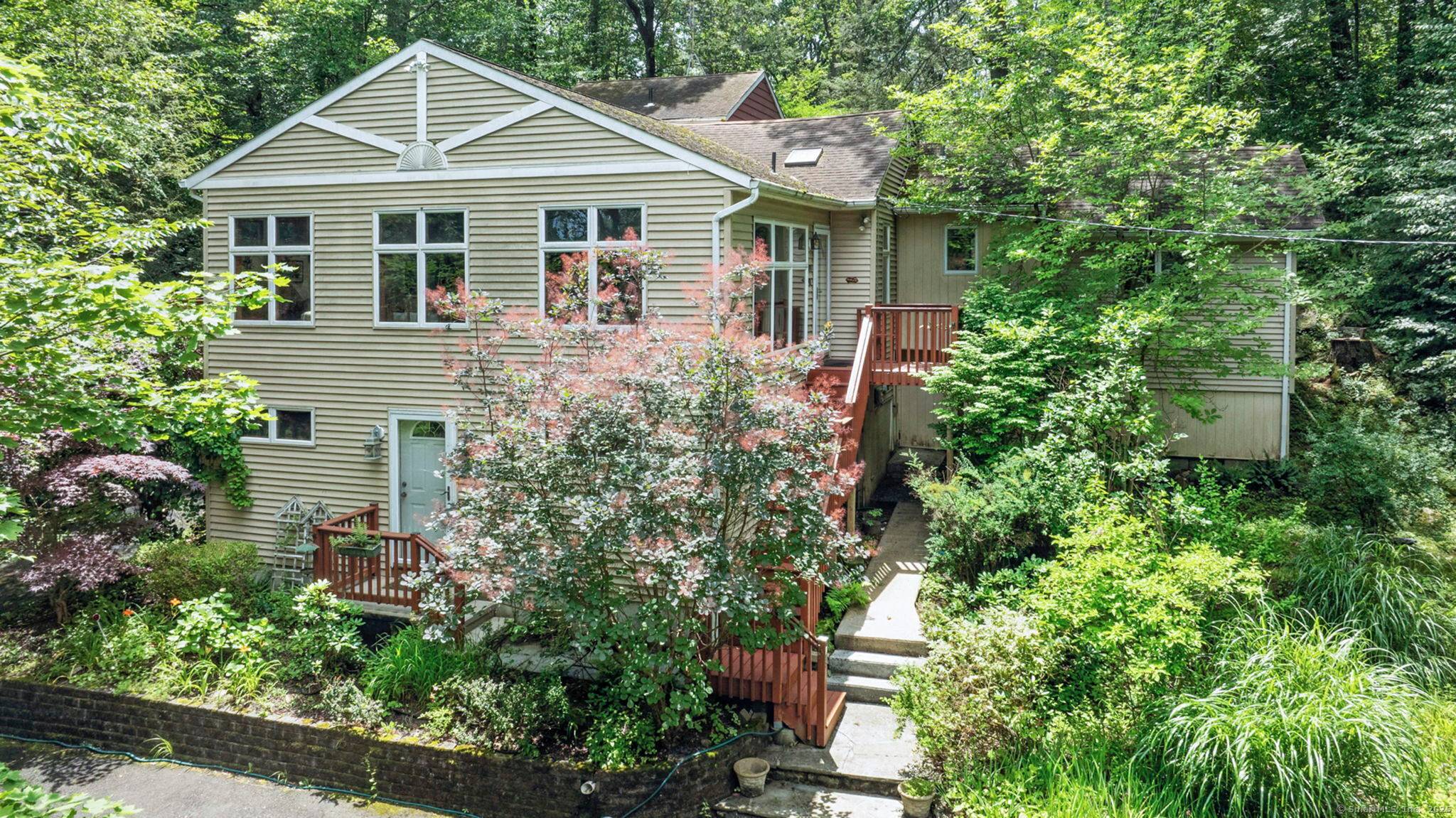 Tucked away in a peaceful, gated lake community, this endearing home offers a lifestyle of comfort, connection, natural beauty.