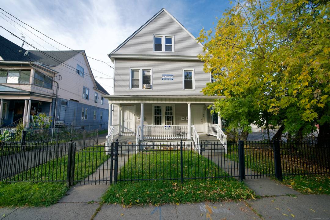 Welcome to this semi renovated three family residence offering modern comfort and exceptional investment potential in Hartford !