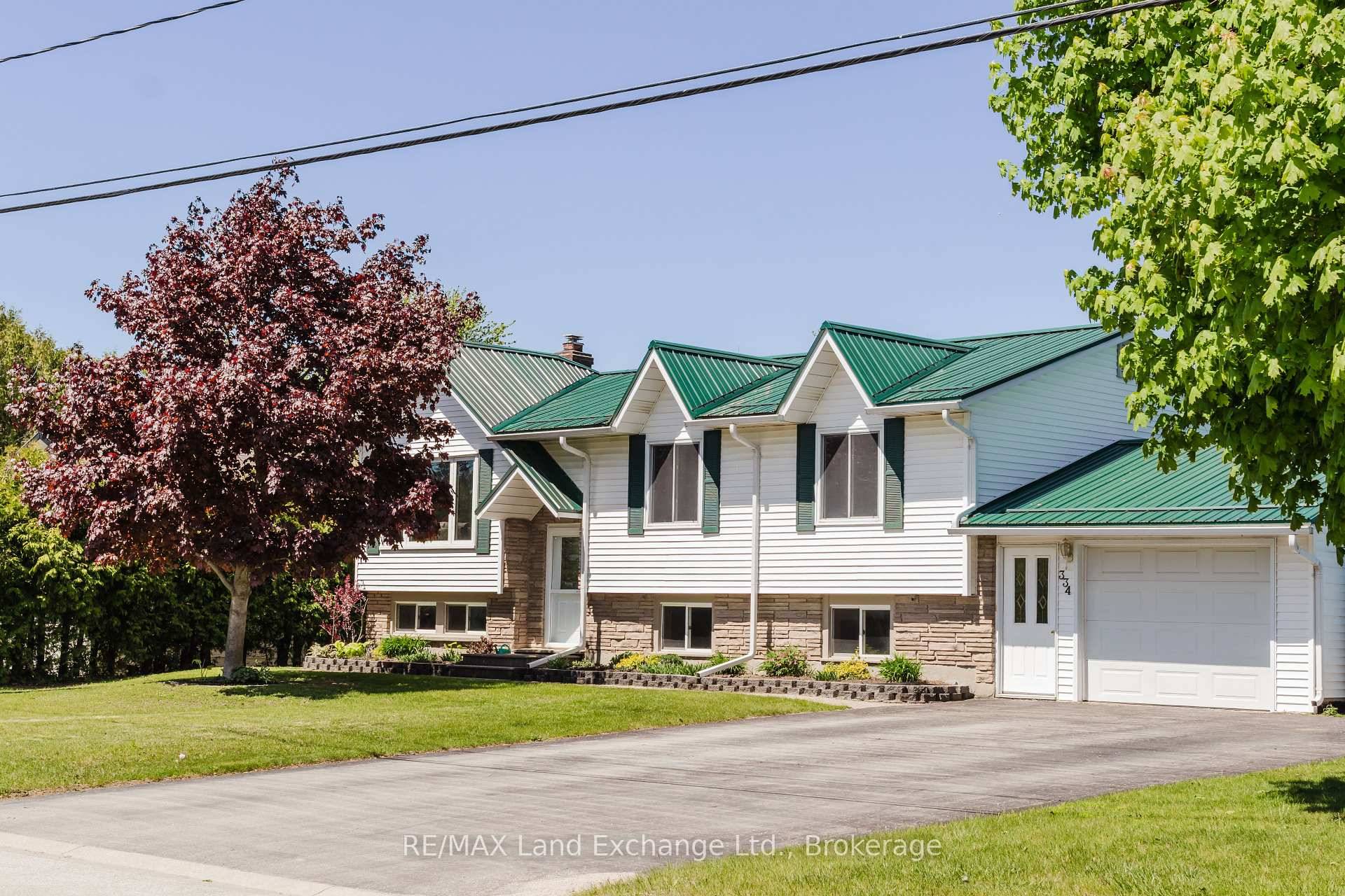 Charming Raised Bungalow with Renovated Kitchen amp ; Bath, Workshop, and Private Yard.