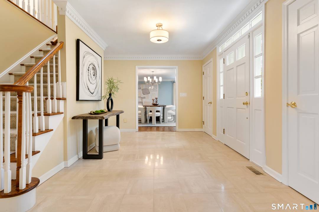 Experience the best of Fairfield County living in this immaculate, sun drenched Colonial, perfectly situated to take in peaceful views of Laurel Lake.